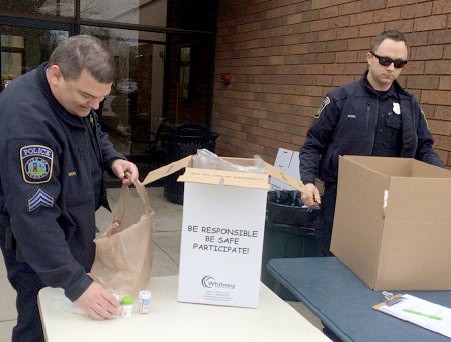 Officers collecting unwanted drugs